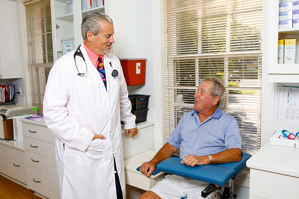 Dr. James meeting with a patient at the Boca Grande Health Clinic