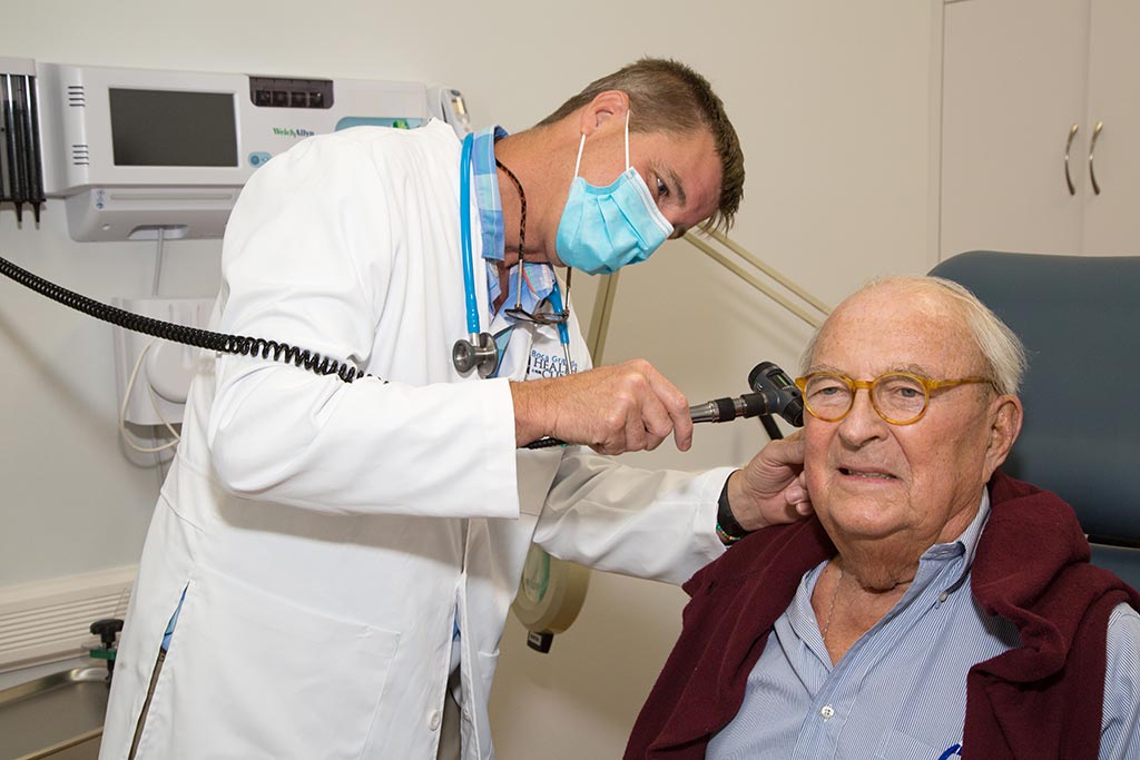 Dr. Kueber with patient at the Boca Grande Health Clinic