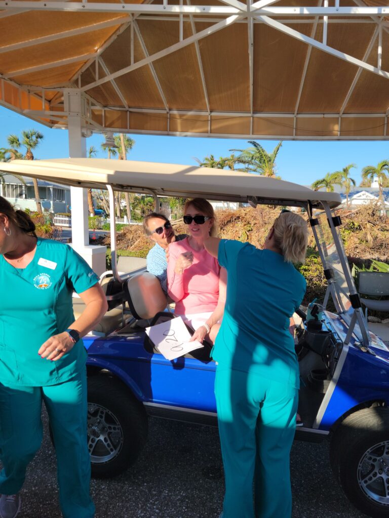 woman getting vaccine in golf cart