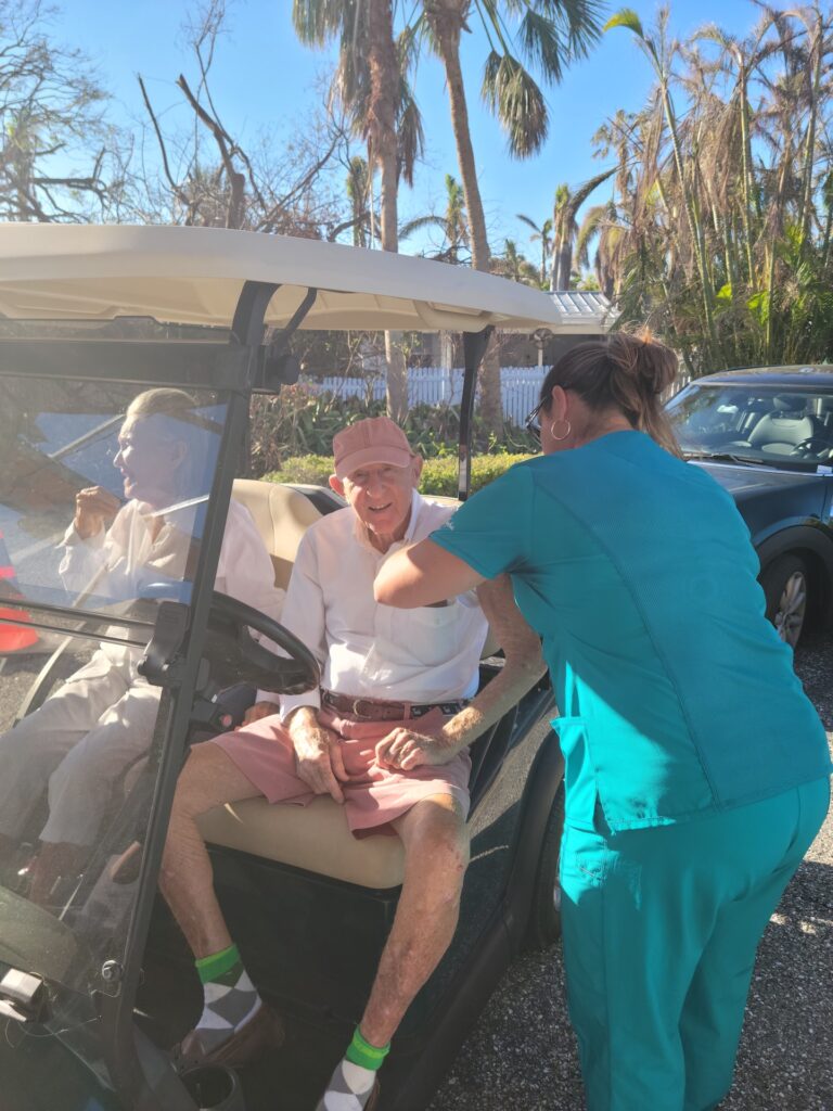 senior getting vaccine in golf cart