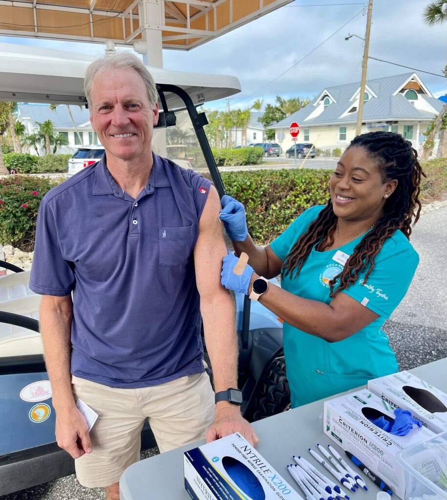 man getting vaccinated at a vaccine drive-through