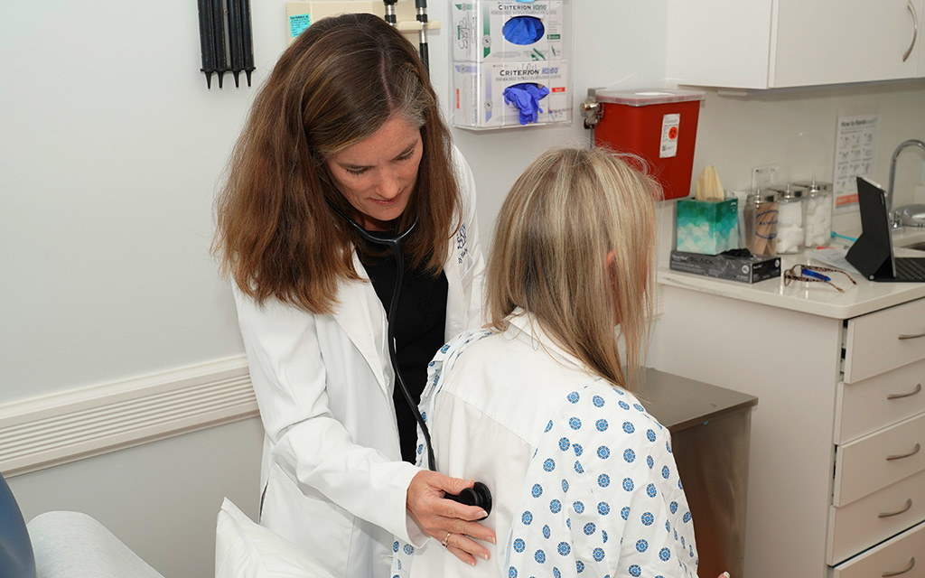Dr. Haly examining a female patient
