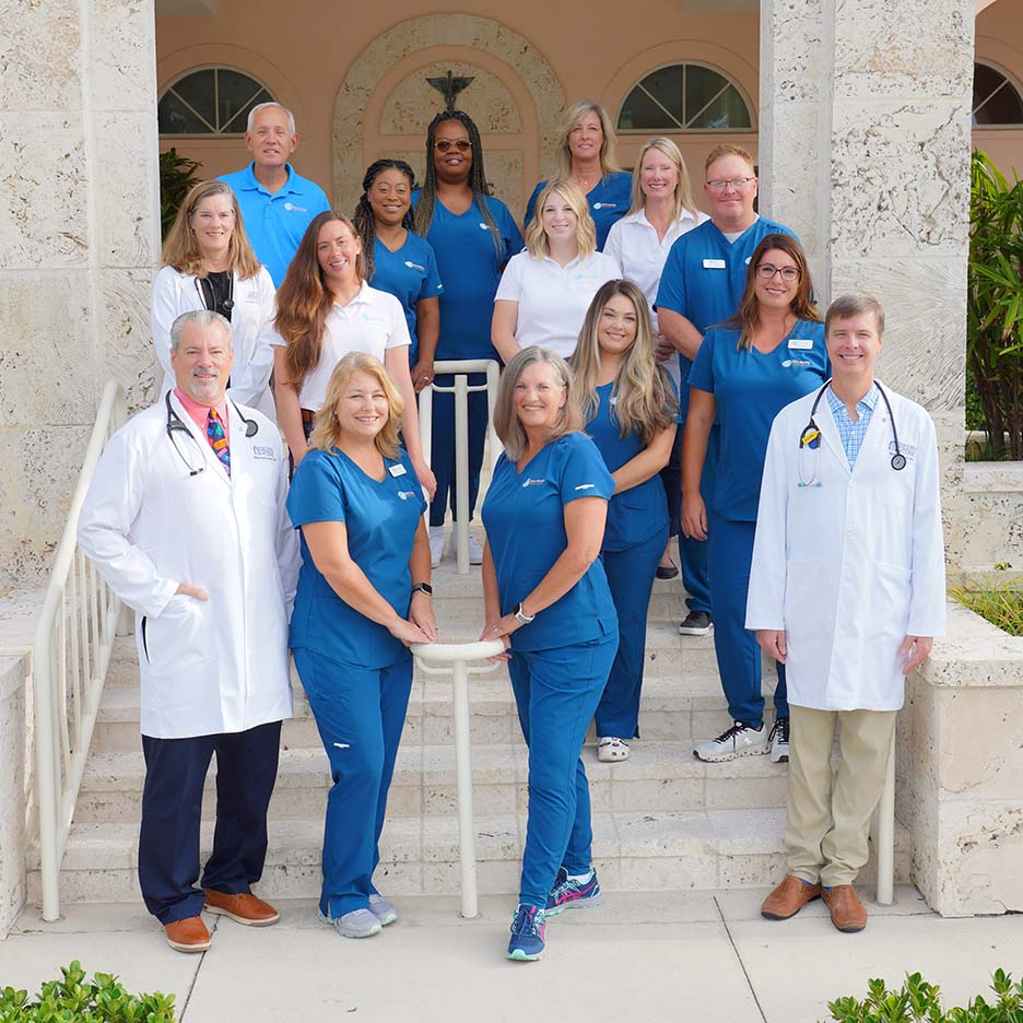 Doctors and Staff on the stairs leading up to the Boca Grande Health Clinic